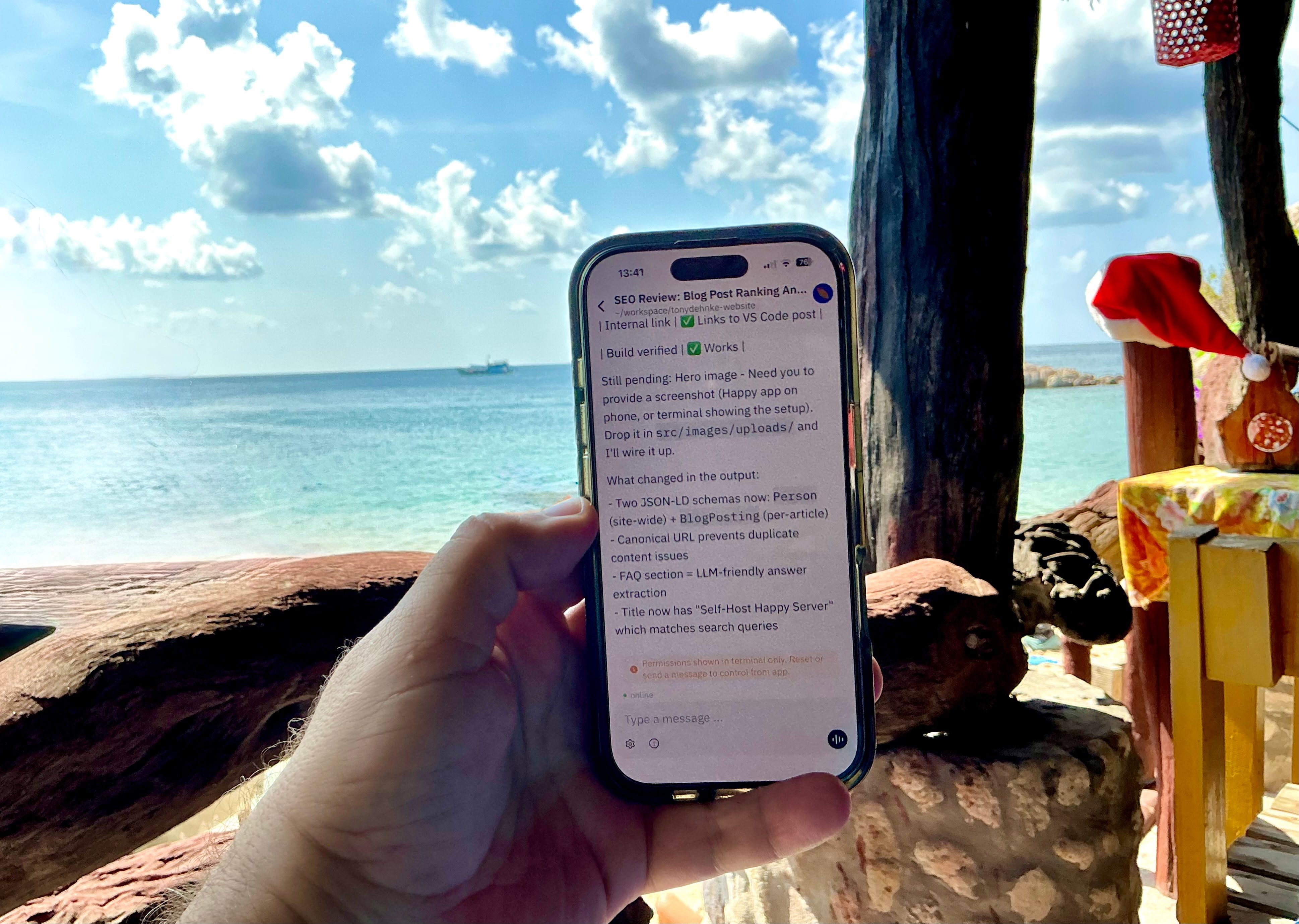 iPhone showing Happy app controlling Claude Code on a tropical beach